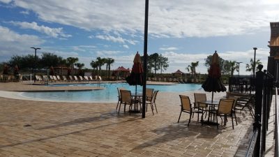 Lodge pool paver patio tables and chairs
