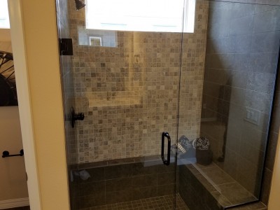 walk in tile shower with frameless glass door
