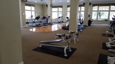 Inside fitness center showing treadmills