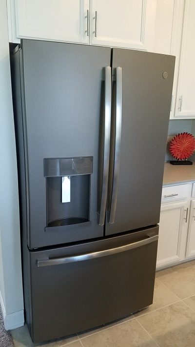 close up of GE refrigerator with freezer on bottom